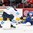 MONTREAL, CANADA - DECEMBER 29: Sweden's Carl Grundstrom #16 lets a shot while falling to the ice as Finland's Urho Vaakanainen #3 defends during preliminary round action at the 2017 IIHF World Junior Championship. (Photo by Francois Laplante/HHOF-IIHF Images)


